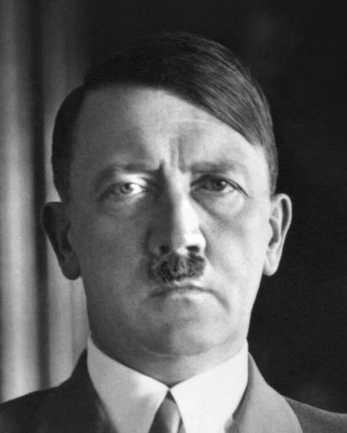 Black-and-white head-and-shoulders portrait of Adolf Hitler in a jacket and tie