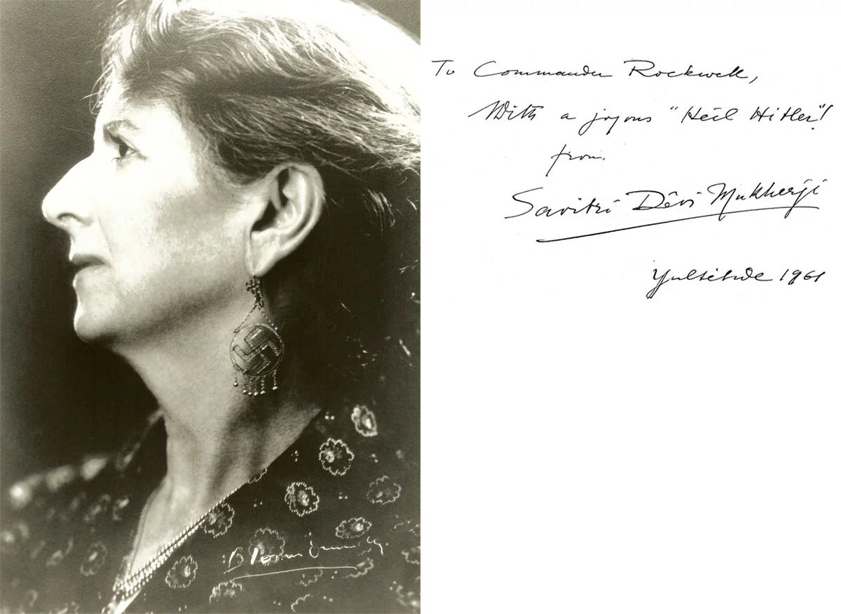 Profile photograph of Savitri Devi in middle age wearing a large swastika earring, beside her handwritten inscription: “To Commander Rockwell, With a joyous ‘Heil Hitler’! from Savitri Devi Mukherji, Yuletide 1961”